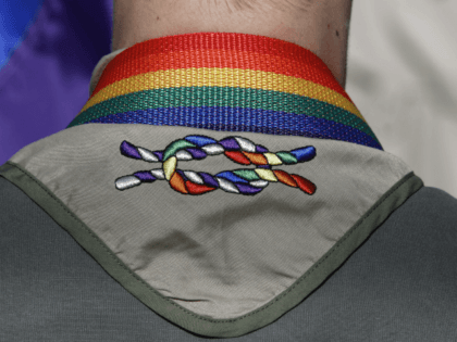 In this June 8, 2014, file photo, a Boy Scout wears his kerchief embroidered with a rainbo