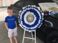 Dakota-Pitts-police-badge-honor-screenshot Dakota Pitts, the five-year-old son of a police officer in Terre Haute, Indiana, who was killed in the line of duty, was presented with a police badge in honor of his father.