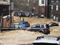 Ellicott-City-Maryland-flooding-May-28-2018-ap Water rushes through Main Street in Ellicott City, Md., Sunday, May 27, 2018. Flash flooding and water rescues are being reported in Maryland as heavy rain soaks much of the state. (Libby Solomon/The Baltimore Sun via AP)