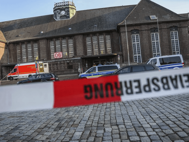 Police secure the main station in Flensburg, northern Germany, Thursday, May 30, 2018 after one person has been killed and two injured in a knife attack on a long-distance train. (Sebastian Iwersen/nordpresse mediendienst/dpa via AP)