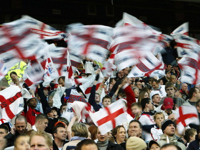 MANCHESTER, ENGLAND - NOVEMBER 16: England fans wave flags during the International Friendly match between England and Denmark at Old Trafford on November 16, 2003 in Manchester, England. (Photo by Laurence Griffiths/Getty Images)