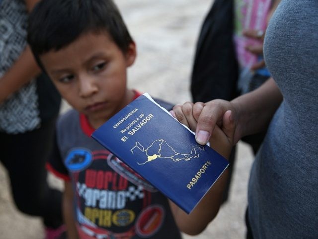 MCALLEN, TX - SEPTEMBER 08: Families of Central American immigrants turn themselves in to U.S. Border Patrol agents after crossing the Rio Grande River from Mexico on September 8, 2014 to McAllen, Texas. Although the numbers of such immigrant families and unaccompanied minors have decreased from a springtime high, thousands …