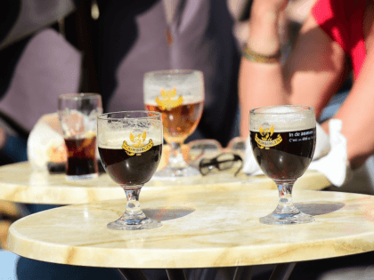 People drink beers at a terrace in Brussels on April 9, 2015. In the fight against drinkin