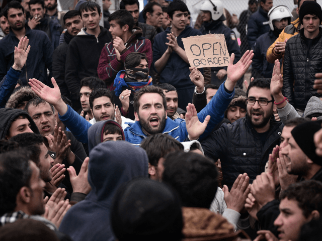 Syrian and Iraqi refugees trapped at the Greek-Macedonian borders protest demanding the opening of the borders on February 28, 2016. More than 5,000 people were trapped at the Idomeni camp after four Balkan countries announced a daily cap on migrant arrivals. Slovenia and Croatia, both EU members, and Serbia and …
