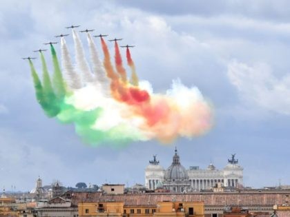 The Italian Air Force aerobatic unit Frecce Tricolori (Tricolor Arrows) spreads smoke with