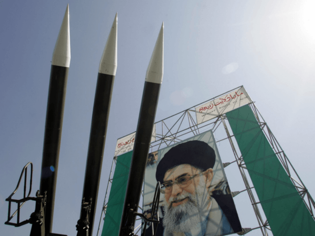 TEHRAN, IRAN: Russian-made Sam-6 surface-to-air missiles are seen in front of a portrait of Iran's Supreme Leader Ayatollah Ali Khamenei at a war exhibition to commemorate the 1980-88 Iran-Iraq war at Baharestan square, south of Tehran 25 September 2005. Saudi Arabia is concerned that US policies are helping Iran make …