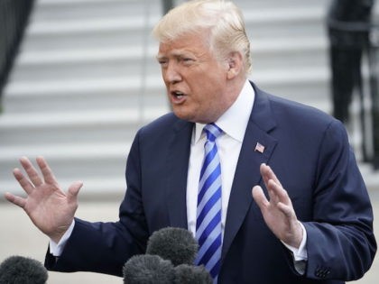 US President Donald Trump speaks to the press before making his way to board Marine One on