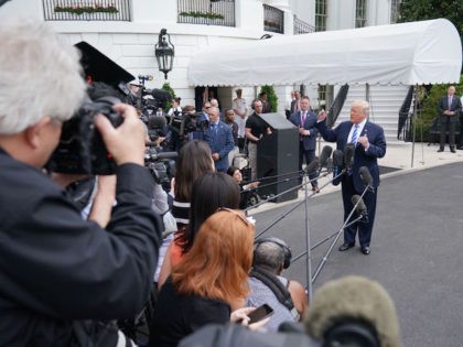 US President Donald Trump speaks to the press before making his way to board Marine One on