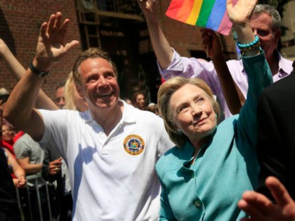 Democratic presidential candidate Hillary Clinton, center, marches with New York Gov. Andrew Cuomo, left, in the New York City Pride Parade in New York, Sunday, June 26, 2016. (AP Photo/Seth Wenig)