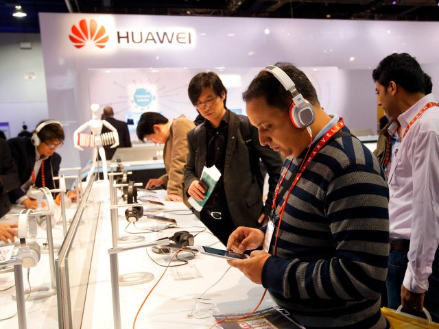 The Huawei booth is shown at the International Consumer Electronics Show in Las Vegas, Thursday, Jan. 10, 2013. (AP Photo/Jae C. Hong)