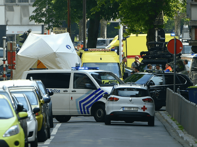 Police and ambulance are seen at the site where a gunman shot dead three people, two of them policemen, before being killed by elite officers, in the eastern Belgian city of Liege on May 29, 2018. - The shooting occurred around 10:30am (0830 GMT) on a major artery in the …