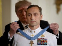 Medal-of-Honor-Master-Chief-Petty-Officer-Britt-K-Slabinski-Donald-Trump-Getty WASHINGTON, DC - MAY 24: Master Chief Petty Officer Britt K. Slabinski is presented with the Medal of Honor by U.S. President Donald Trump May 24, 2018 in Washington, DC. Slabinksi received the Medal of Honor for heroic actions performed in a firefight while serving as a Navy SEAL in …