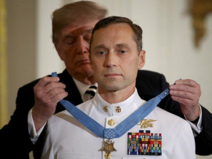 WASHINGTON, DC - MAY 24: Master Chief Petty Officer Britt K. Slabinski is presented with the Medal of Honor by U.S. President Donald Trump May 24, 2018 in Washington, DC. Slabinksi received the Medal of Honor for heroic actions performed in a firefight while serving as a Navy SEAL in …
