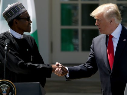 U.S. President Donald Trump (R) and Nigerian President Muhammadu Buhari (L) shake hands du