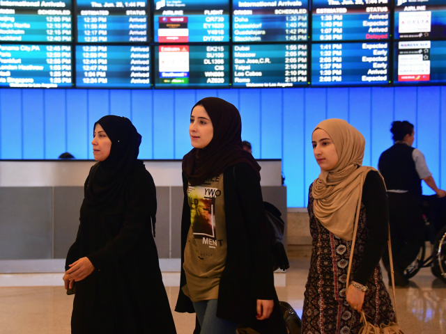 Travellers from the Middle East arrive at the International Arrivals section at Los Angeles International Airport on June 29, 2017, where free legal advice was offered and activists protested President Donald Trump's ban temporarily barring entry into the US from Libya, Iran, Somalia, Sudan, Syria and Yemen. The ban prevents …