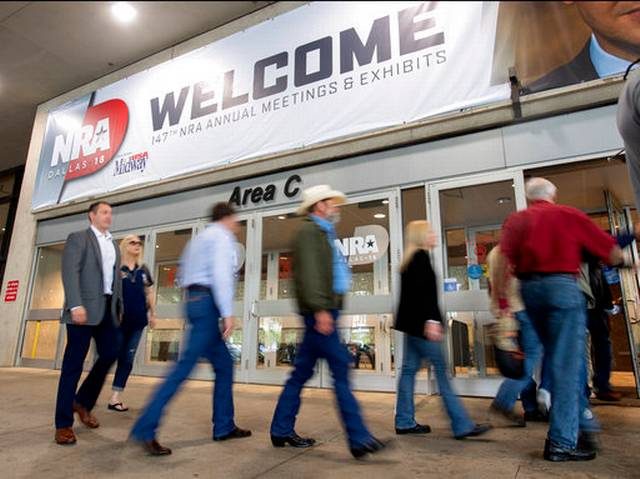 Attendees enter the National Rifle Association Annual Meeting on Friday, May 4, 2018, at the Kay Bailey Hutchison Convention Center in Dallas. (AP Photo/Jeffrey McWhorter)