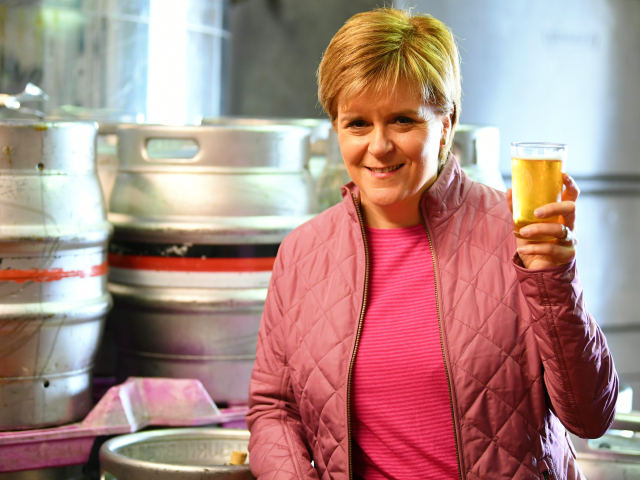 BARRHEAD, SCOTLAND - JUNE 02: SNP leader Nicola Sturgeon has a ping of beer as she takes a tour of Kelburn Brewery while campaigning for the General Election on June 2, 2017 in Barrhead, East Renfrewshire, Scotland. Polls are showing the SNP out in front and the Conservatives set to …