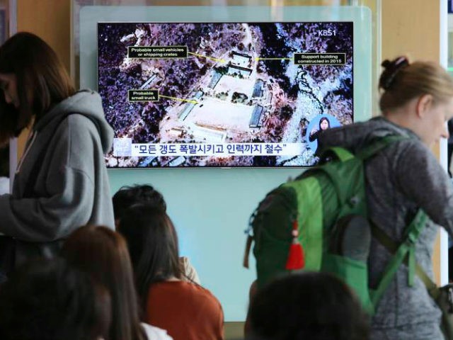 A TV screen shows a satellite image of the Punggye-ri nuclear test site in North Korea during a news program at the Seoul Railway Station in Seoul, South Korea, Sunday, May 13, 2018. North Korea said Saturday that it will dismantle its nuclear test site in less than two weeks, …