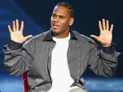 Singer R. Kelly performs at the '18th Annual Soul Train Music Awards' at the Scottish Rite Auditorium on March 20, 2004 in Los Angeles, California. (Photo by Kevin Winter/Getty Images)