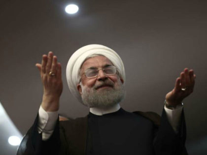 Iranian President Hassan Rouhani gestures during a campaign rally in the northwestern city