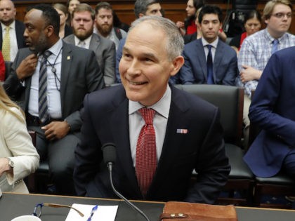 Environmental Protection Agency Administrator Scott Pruitt takes his seat as he arrives to testify before the House Energy and Commerce subcommittee hearing on Capitol Hill in Washington, Thursday, April 26, 2018. Sitting next to Pruitt is Holly Greaves, EPA Chief Financial Officer. (AP Photo/Pablo Martinez Monsivais)