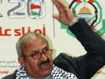 Talal Naji, the assistant secretary-general of the Popular Front for the Liberation of Palestine –General Command , reads the statement of the Damascus-based radical Palestinian factions during a festival held Friday, Jan. 4, 2008 at al-Haifaa Sports Stadium in Damascus to mark the 20th anniversary of Hamas' foundation. Naji urged …