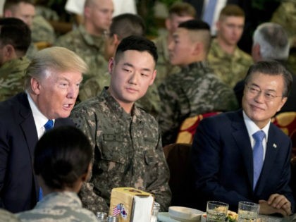 U.S. President Donald Trump and South Korean President Moon Jae-in, right, have lunch with U.S. and South Korean troops at Camp Humphreys in Pyeongtaek, South Korea, Tuesday, Nov. 7, 2017. Trump is on a five-country trip through Asia traveling to Japan, South Korea, China, Vietnam and the Philippines. (AP Photo/Andrew …