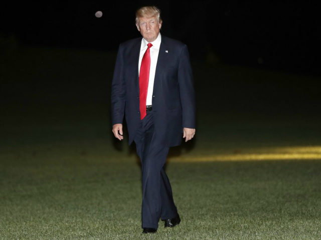 President Donald Trump walks across the South Lawn of the White House in Washington, Tuesday, June 13, 2017, following his arrival on Marine One helicopter from nearby Andrews Air Force Base. Trump was returning from a trip to Milwaukee. (AP Photo/Pablo Martinez Monsivais)
