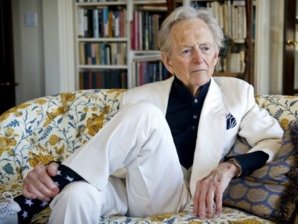 In this July 26, 2016 photo, American author and journalist Tom Wolfe, Jr. appears in his living room during an interview about his latest book, "The Kingdom of Speech," in New York. (AP Photo/Bebeto Matthews)