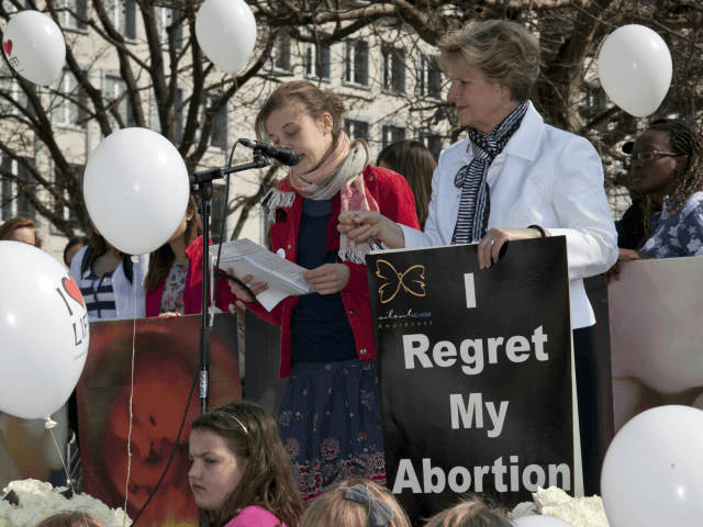 Angelina Steenstra (L), from Silent No More organization in Canada gives a speech during t