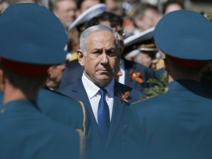 Israeli Prime Minister Benjamin Netanyahu attends a wreath-laying ceremony at the Tomb of the Unknown Soldier after the Victory Parade marking the 73th anniversary of the defeat of the Nazis in World War II, in Moscow, Russia, Wednesday, May 9, 2018. (AP Photo/Alexander Zemlianichenko)
