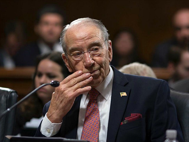 Amid President Donald Trump's repeated criticism of special counsel Robert Mueller's Russia investigation, Senate Judiciary Committee Chairman Chuck Grassley, R-Iowa, works on a bipartisan bill to protect the special counsel should Trump try to fire him, on Capitol Hill in Washington, Thursday, April 26, 2018. The Special Counsel Independence and …