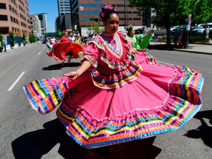 DENVER, CO - MAY 6: Dancers from the Colorado Mestizo Dancers perform near Lincoln and Colfax Ave during the 30th annual Cinco de Mayo 'Celebrate Culture Festival parade May 6, 2017 in Denver, Colorado. Over 400,000 festival goers are expected to attend the festival May 6th and May 7th at …
