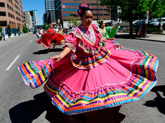 DENVER, CO - MAY 6: Dancers from the Colorado Mestizo Dancers perform near Lincoln and Col