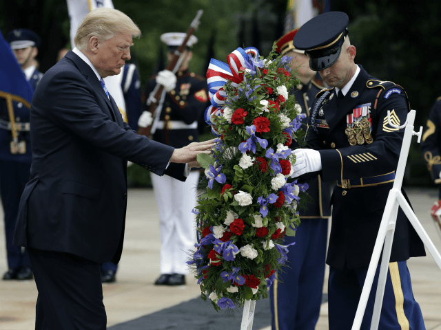President Donald Trump lays a wreath at the Tomb of the Unknown Soldier at Arlington Natio