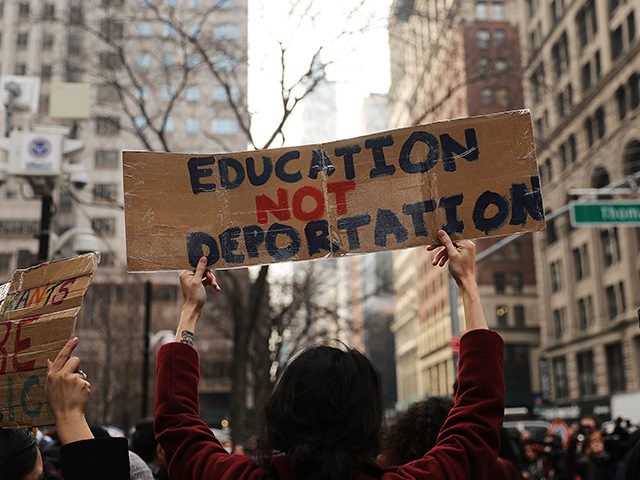 NEW YORK, NY - JANUARY 22: Demonstrators, many of them recent immigrants to America, protest the government shutdown and the lack of a deal on DACA (Deferred Action for Childhood Arrivals) outside of Federal Plaza on January 22, 2018 in New York City. As the Trump administration continues to focus …