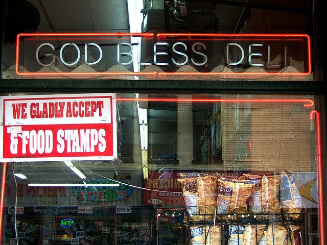 We Accept Food Stamps sign in the window of God Bless Deli