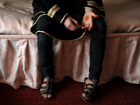 This picture taken in Kabul on October 12, 2011 shows Afghan woman Nozari as she poses for a portrait at a shelter run by women for Afghan women. Nozari fled her home due to alleged domestic violence and discrimination. In the war-torn country, Afghan women often oppressed by poverty, family …