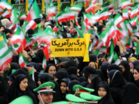 iran anti america U.S. Iranian schoolgirls wave their national flag and hold an anti-US slogan during celebrations in Tehran's Azadi Square (Freedom Square) to mark the 37th anniversary of the Islamic revolution on February 11, 2016. / AFP / ATTA KENARE (Photo credit should read ATTA KENARE/AFP/Getty Images)