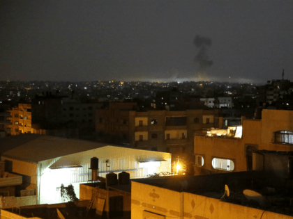 Smoke rises following an Israeli strikes on Gaza City, early Wednesday, May 30, 2018. Palestinian militants bombarded southern Israel with dozens of rockets and mortar shells while Israeli warplanes struck targets throughout the Gaza Strip in the largest flare-up of violence between the sides since a 2014 war. (AP Photo/Hatem …