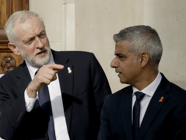 Britain's opposition Labour party leader Jeremy Corbyn, left, talks with London mayor Sadiq Khan, as they wait to pose for a group photograph after the Memorial Service to commemorate the 25th anniversary of the murder of black teenager Stephen Lawrence at St Martin-in-the-Fields church in London, Monday, April 23, 2018. …
