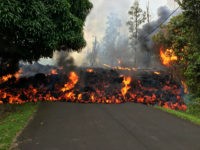 lava-from-kilauea-volcano-flowing-5-5-18-getty PAHOA, HI - MAY 6: In this handout photo provided by the U.S. Geological Survey, a lava flow moves on Makamae Street after the eruption of Hawaii's Kilauea volcano on May 6, 2018 in the Leilani Estates subdivision near Pahoa, Hawaii. The governor of Hawaii has declared a local state …