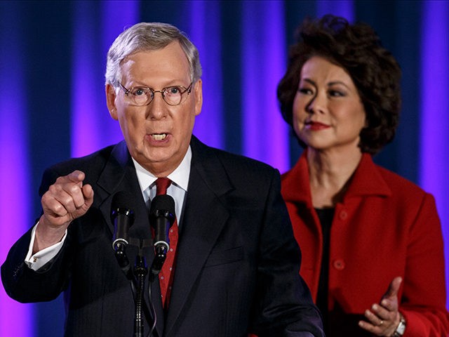 FILE - In this Nov. 4, 2014 file phot, Senate Minority Leader Mitch McConnell of Ky., joined by his wife, former Labor Secretary Elaine Chao, celebrates with his supporters at an election night party in Louisville, Ky. President Barack Obama has the upper hand in the fierce struggle over immigration …