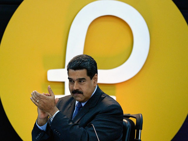 Venezuela's President Nicolas Maduro gestures during a press conference to launch to the market a new oil-backed cryptocurrency called 'Petro', at the Miraflores Presidential Palace in Caracas, on February 20, 2018. Venezuela formally launched its new oil-backed cryptocurrency on Tuesday in an unconventional bid to haul itself out of a …