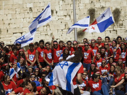 Jewish youth from Paraguay, pose for a photo, in front the Western Wall, Judaism's holiest site in Jerusalem, Wednesday, April 29, 2009 after participating in the ''March of the living". Israelis are celebrating Independence Day, marking the 61st anniversary of the creation of the state. (AP Photo/Bernat Armangue)