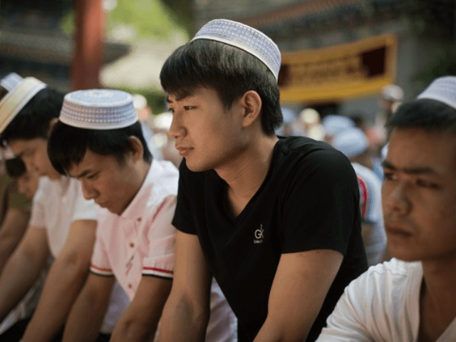 Chinese Muslims offer prayers during Eid al-Fitr at the Niujie mosque in Beijing on June 2