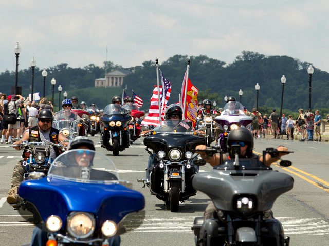 Participants in the Rolling Thunder motorcycle rally ride past Arlington Memorial Bridge, during the annual Rolling Thunder parade, ahead of Memorial Day on Sunday, May 27, 2018, in Washington. (AP Photo/Jose Luis Magana)