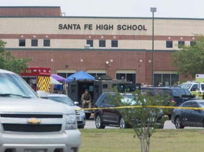 Emergency crews gather in the parking lot of Santa Fe High School where at least eight people were killed on May 18, 2018 in Santa Fe, Texas. - At least eight people were killed when a student opened fire at his Texas high school on May 18, 2018, as President …