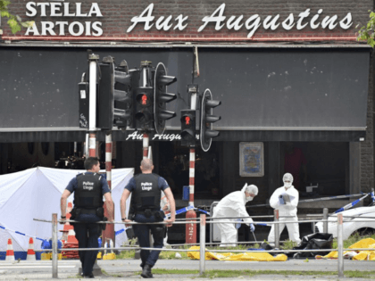 Forensic police, right, investigate at the scene of a shooting in Liege, Belgium, Tuesday, May 29, 2018. A gunman killed three people, including two police officers, in the Belgian city of Liege on Tuesday, a city official said. Police later killed the attacker, and other officers were wounded in the …