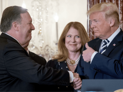 From left, Secretary of State Mike Pompeo, accompanied by his wife Susan, gets a thumbs up from President Donald Trump, after being ceremonially sworn in at the State Department, Wednesday, May 2, 2018, in Washington. (AP Photo/Andrew Harnik)